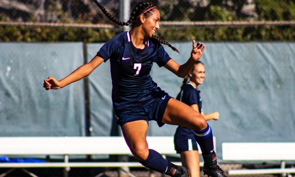 Basurto clicks her heels after scoring a goal. Photo by Jim McCormack.