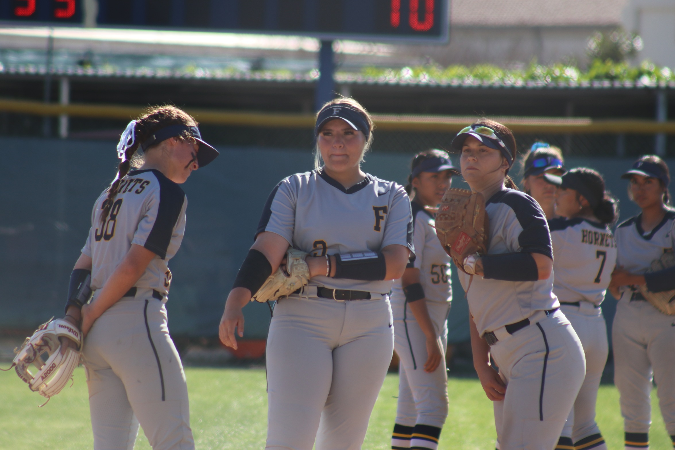 Madison Pevehouse (center) was 3 for 3 with 4 RBI on the day for FC.